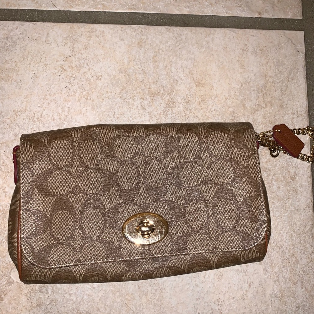 Coach wristlet or crossbody(comes with strap)